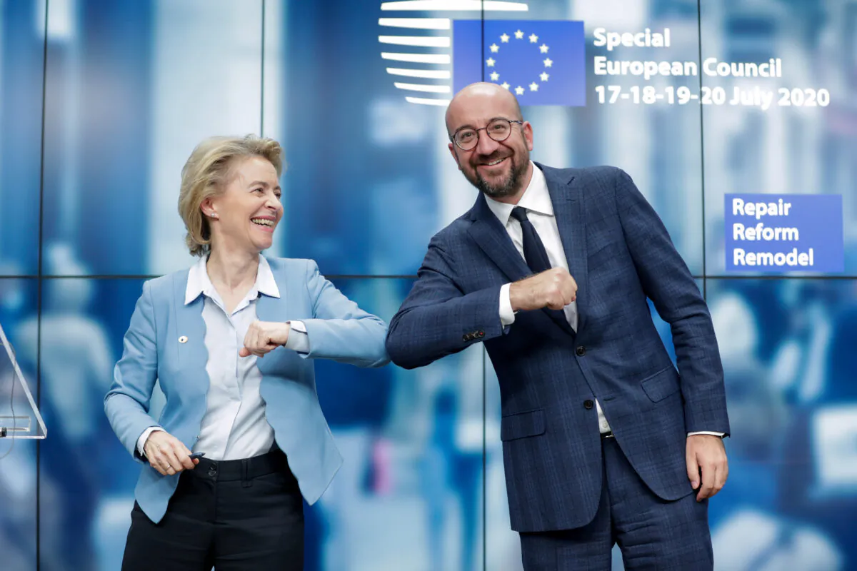 European Council President Charles Michel and European Commission President Ursula Von Der Leyen do an elbow bump at the end of a news conference following a 4-day European summit at the European Council in Brussels on July 21, 2020. (Stephanie Lecocq/Pool via Reuters)