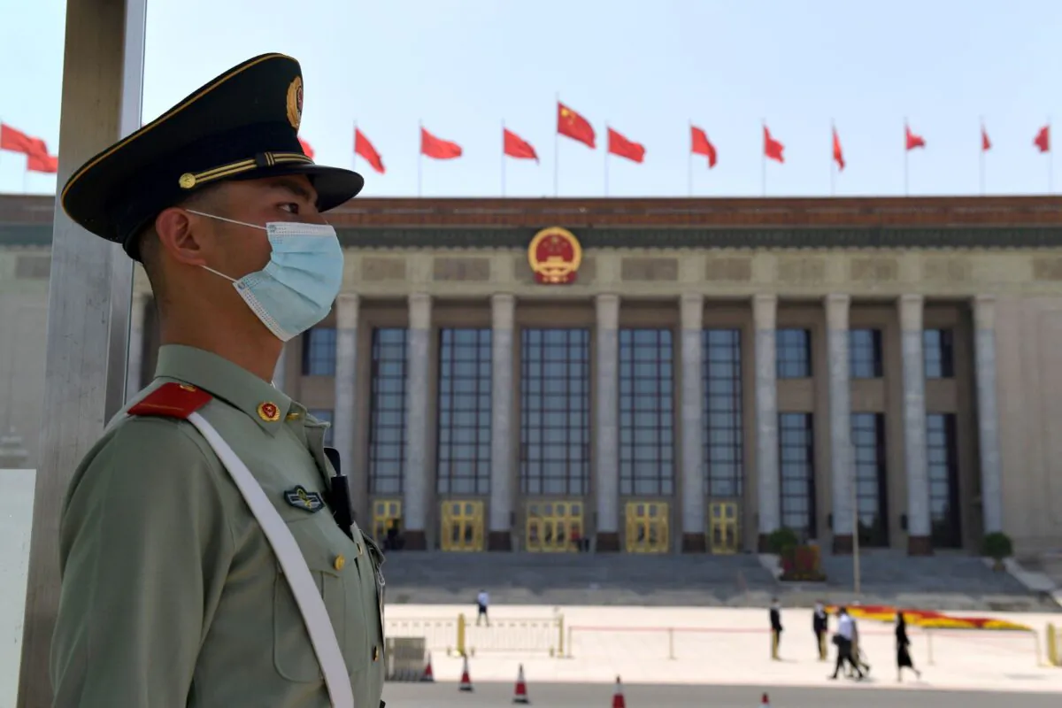 A paramilitary policeman stands guard outside the Great Hall of the People ahead of the closing session of the National People's Congress in Beijing on May 28, 2020. (Nicolas Asfouri/AFP via Getty Images)