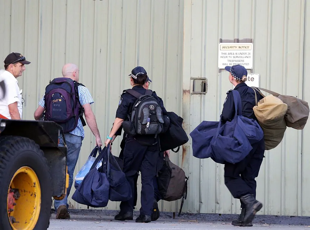 Queensland Police officers enter the site of a park ride accident that killed four at the Dreamworld theme park on Gold Coast on October 25, 2016.
(TERTIUS PICKARD/AFP via Getty Images)