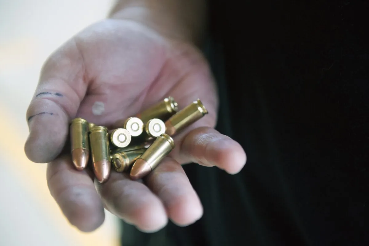 A person holds bullets in a file photograph. (Jason Connolly/AFP via Getty Images)