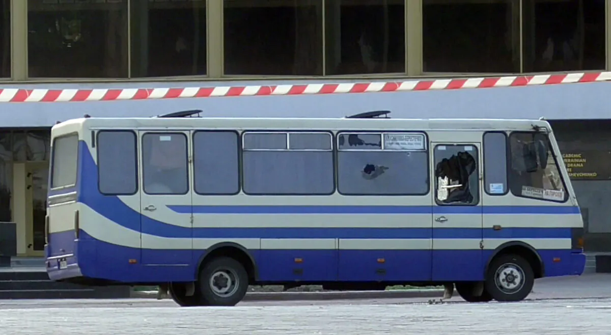 A bus with people held hostage after an armed man seized a bus and took some 10 people hostage in the city center of Lutsk, west of Kyiv, Ukraine, on July 21, 2020. (Ukrainian Police Press Office via AP)