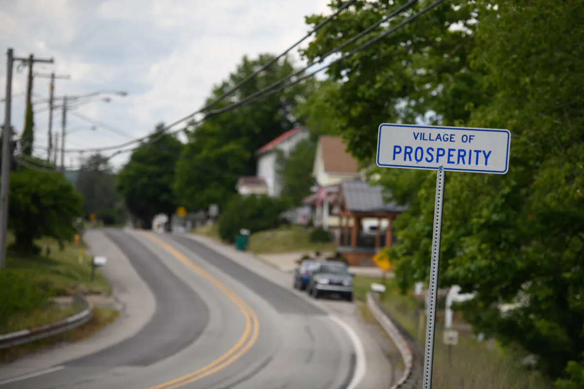 The sign for the village of Prosperity sits along state Route 18. (Justin Merriman)