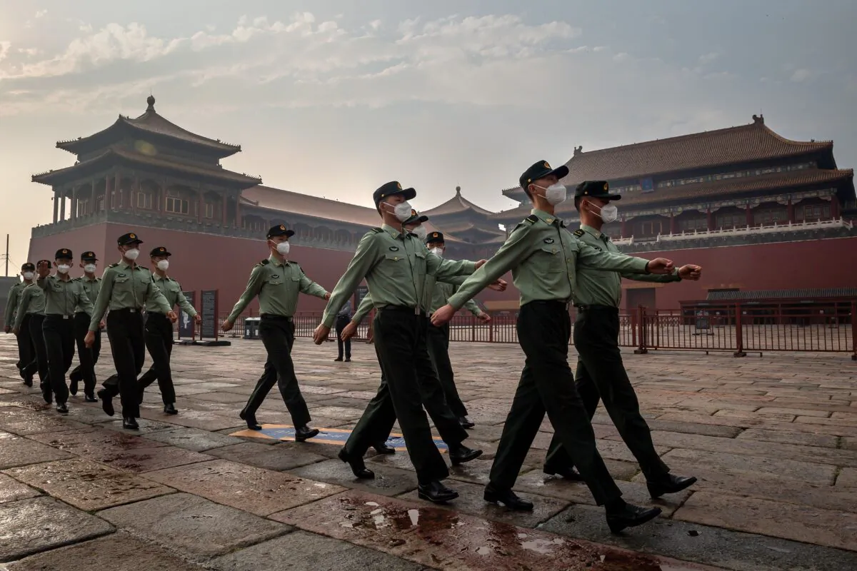 People's Liberation Army (PLA) soldiers march next to the entrance to the Forbidden City during the opening ceremony of the Chinese People's Political Consultative Conference (CPPCC) in Beijing on May 21, 2020. (Nicolas Asfouri/AFP via Getty Images)