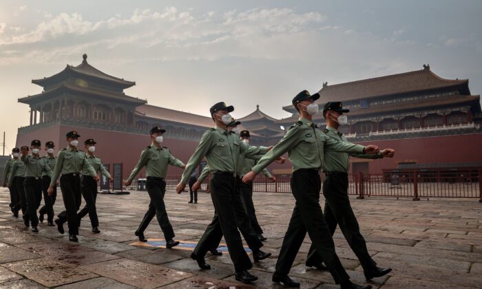 People's Liberation Army (PLA) soldiers march next to the entrance to the Forbidden City during the opening ceremony of the Chinese People's Political Consultative Conference (CPPCC) in Beijing on May 21, 2020. (Nicolas Asfouri/AFP via Getty Images)