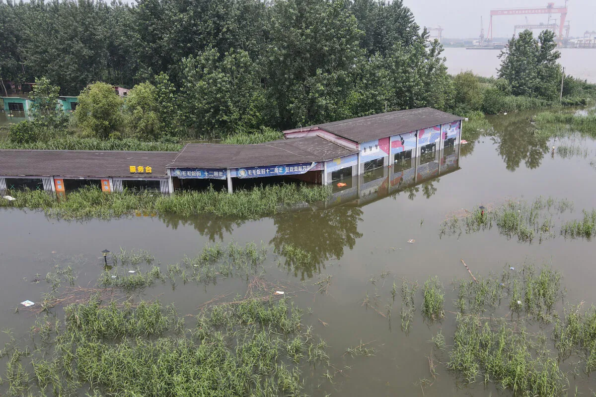 A building is inundated by flood in Zhenjiang, China, on July 20, 2020. (STR/AFP via Getty Images)