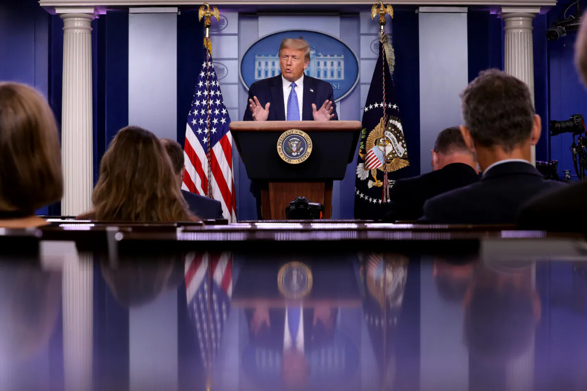 President Donald Trump talks to journalists during a news conference about his administration's response to the COVID-19 pandemic in the Brady Press Briefing Room at the White House in Washington on July 22, 2020. (Chip Somodevilla/Getty Images)