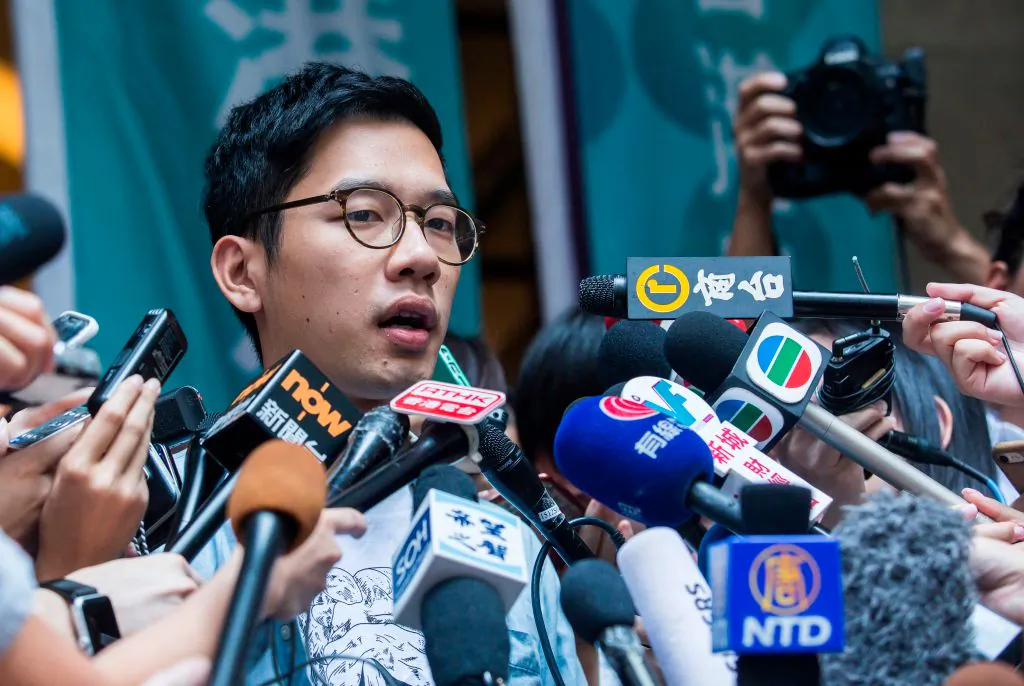 Pro-democracy activist Nathan Law speaks to the media outside the Court of Final Appeal in Hong Kong on Oct. 24, 2017. (Isaac Lawrence/AFP via Getty Images)