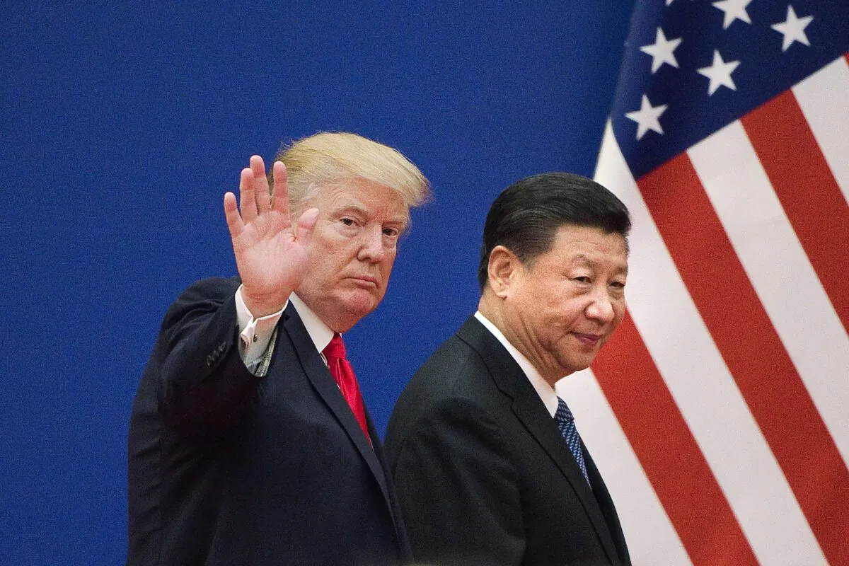 President Donald Trump and China's leader Xi Jinping leave a business leaders event at the Great Hall of the People in Beijing, China, on Nov. 9, 2017.  (NICOLAS ASFOURI/AFP via Getty Images)