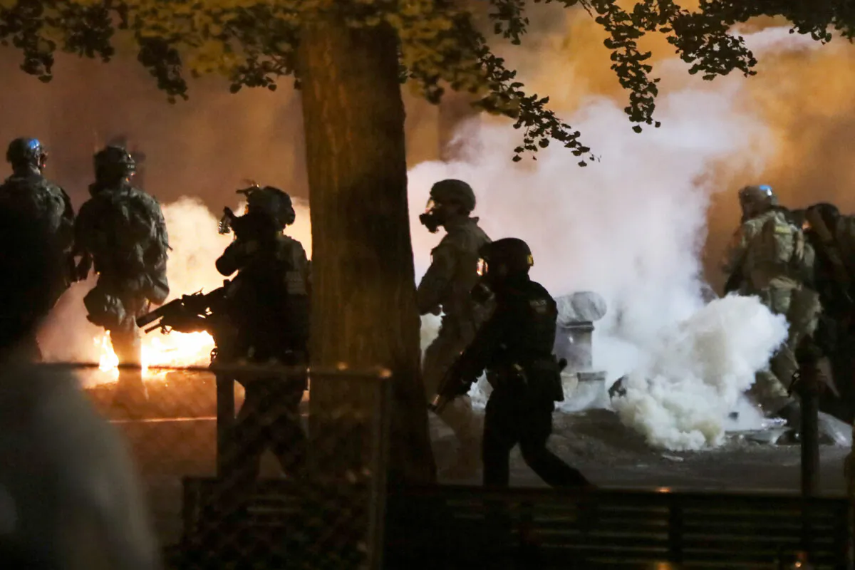 Federal law enforcement officers face off with rioters in Portland, Ore., on July 21, 2020. (Caitlin Ochs/Reuters)