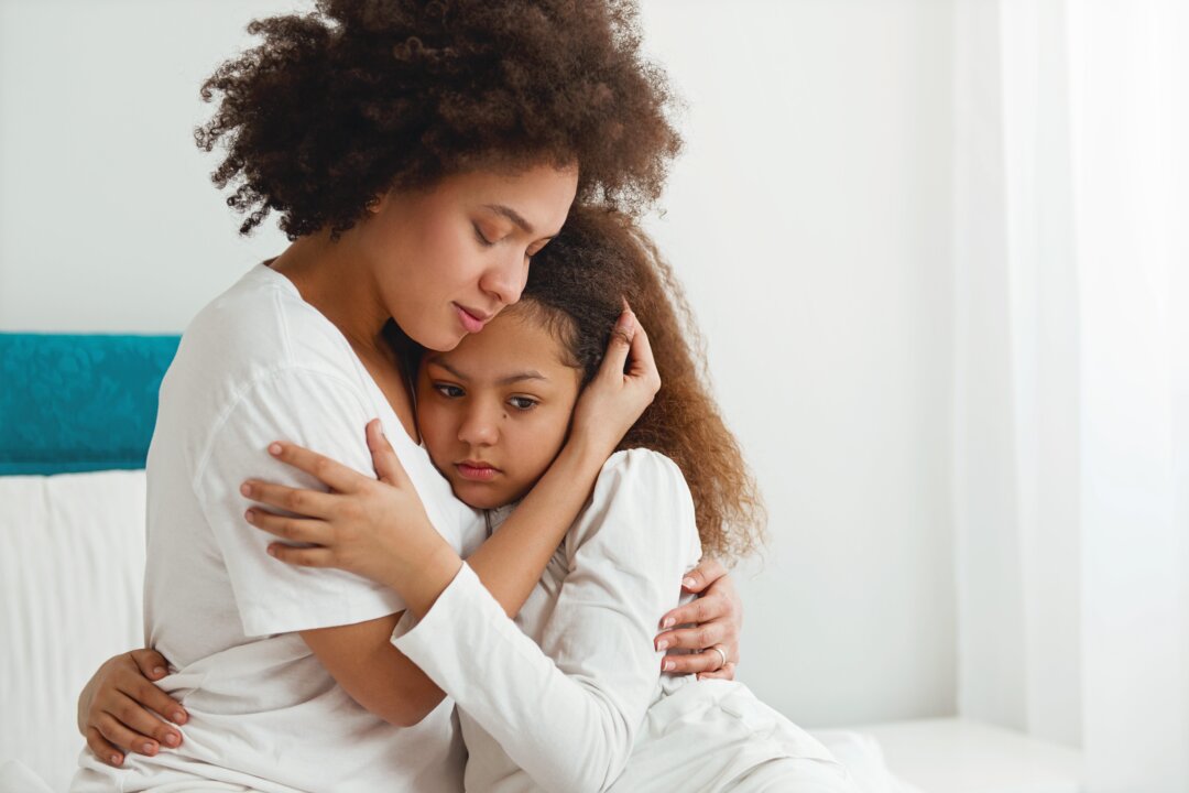 It is normal for parents to grieve the loss of a loved one. Doing so shows children how loss can affect us, and how to move through it. (TijanaM/shutterstock)