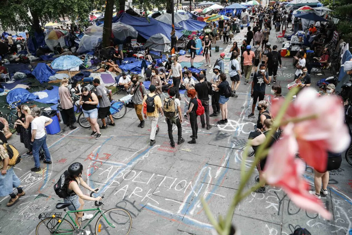 Protesters gather at an encampment outside City Hall in New York City on June 30, 2020. (John Minchillo/AP Photo)