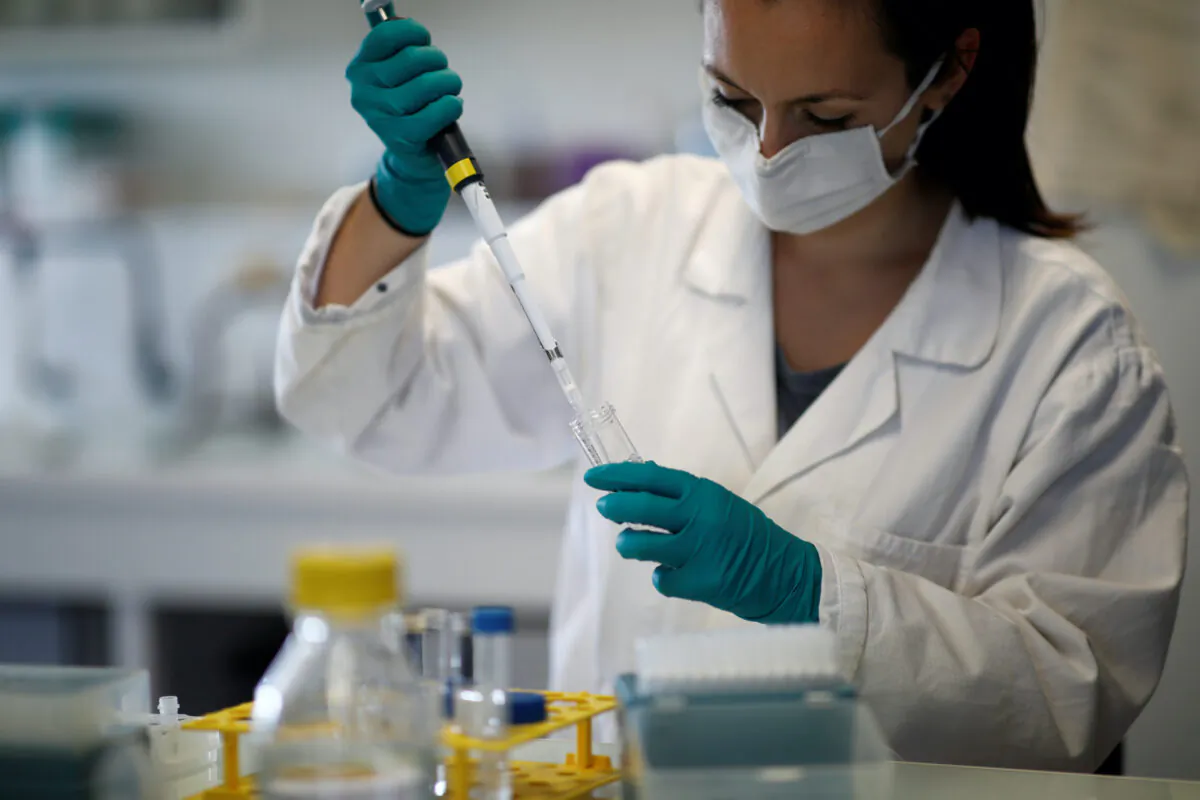 A water quality scientist, conducts tests on a water sample at the Eau de Paris research and analysis laboratories in Ivry-sur-Seine, near Paris, France, on July 22, 2020. (Benoit Tessier/Reuters)