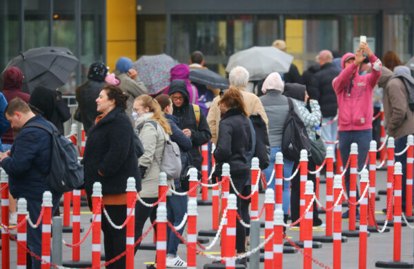 Customers wait outside an IKEA shop