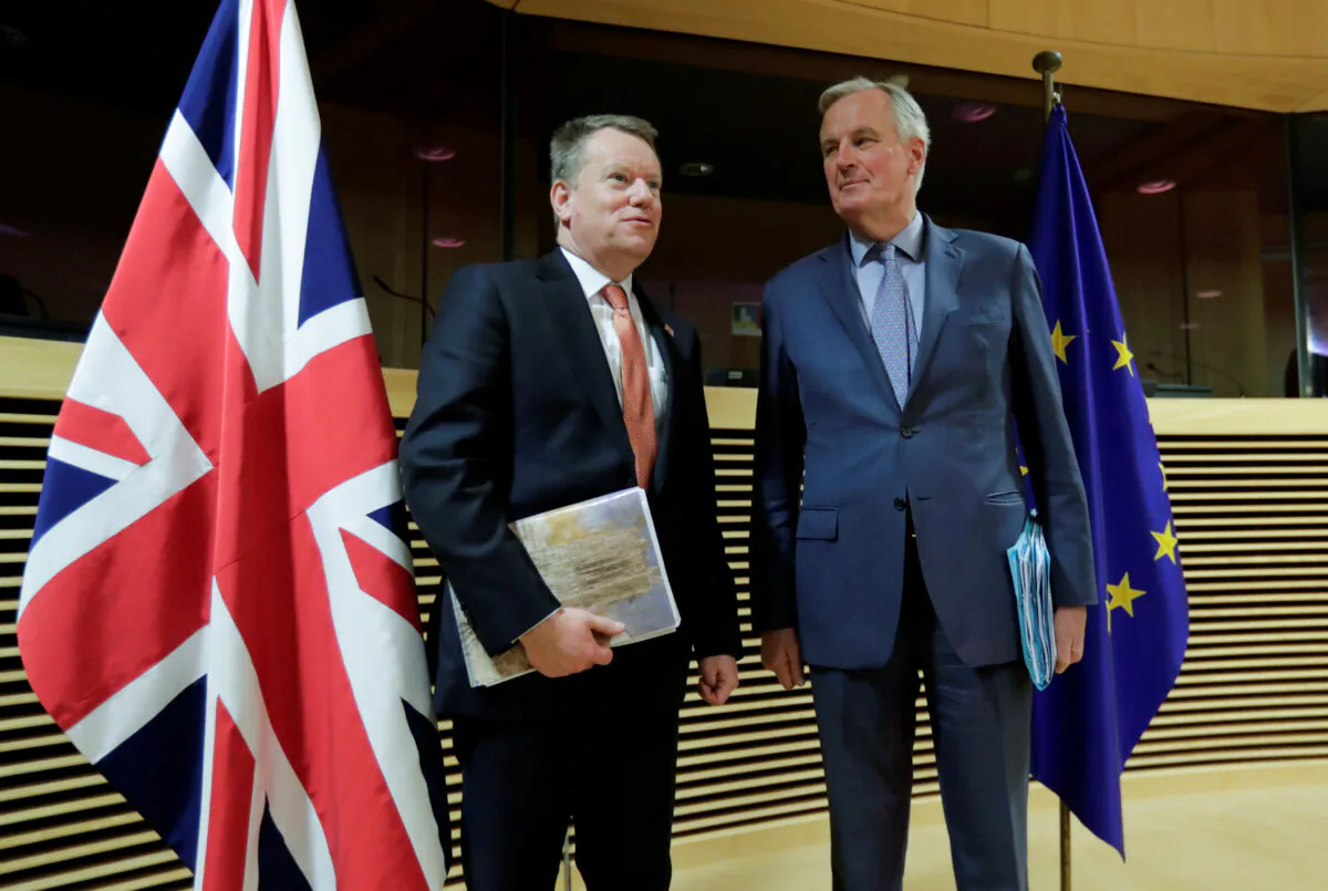 European Union chief Brexit negotiator Michel Barnier and British Prime Minister's Europe adviser David Frost are seen at start of the first round of post -Brexit trade deal talks between the EU and the United Kingdom, in Brussels, Belgium, on March 2, 2020. (Oliver Hoslet/Pool via Reuters)