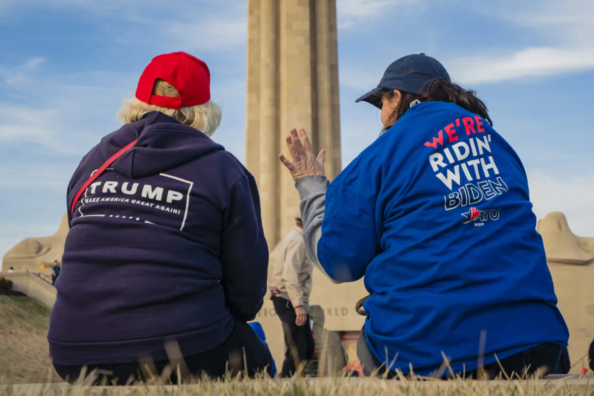 A President Donald Trump and a former Vice President Joe Biden supporter converse before the Joe Biden Campaign Rally at the National World War I Museum and Memorial in Kansas City, Miss., on March 7, 2020. (Kyle Rivas/Getty Images)