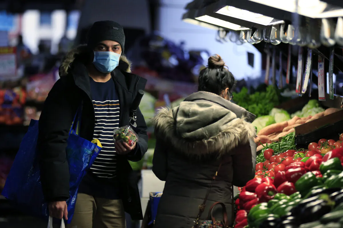 People are seen wearing face masks while shopping at the Queen Victoria Market in Melbourne, Australia on July 11, 2020. (Darrian Traynor/Getty Images)