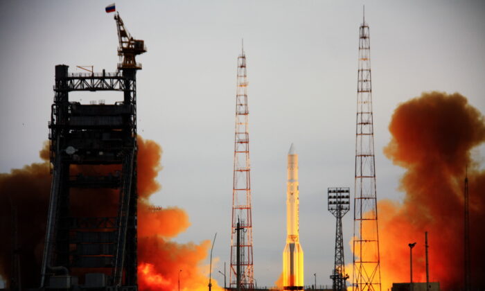 Russia's Proton rocket, carrying the Kosmos military satellite, blasts off a launch pad at Kazakhstan's Baikonur cosmodrome on March 30, 2012. (STR/AFP via Getty Images)