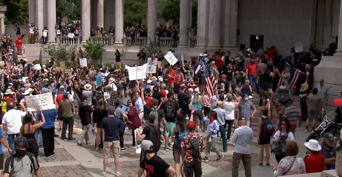 A pro-police rally in Denver, Colo., on July 20, 2020. Police were given a stand-down order, the police union chief said, and didn't intervene when rallygoers were attacked by counter-demonstrators. (KDVR)