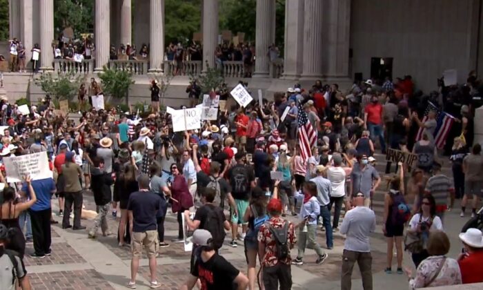 A pro-police rally in Denver, Colo., on July 20, 2020. Police were given a stand-down order, the police union chief said, and didn't intervene when rallygoers were attacked by counter-demonstrators. (KDVR)