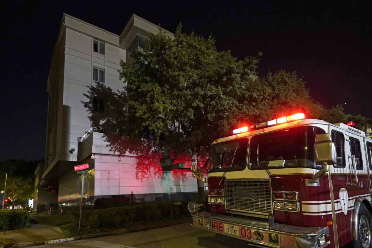 A firetruck is positioned outside the Chinese Consulate Wednesday, July 22, 2020, in Houston.  (AP Photo/David J. Phillip)