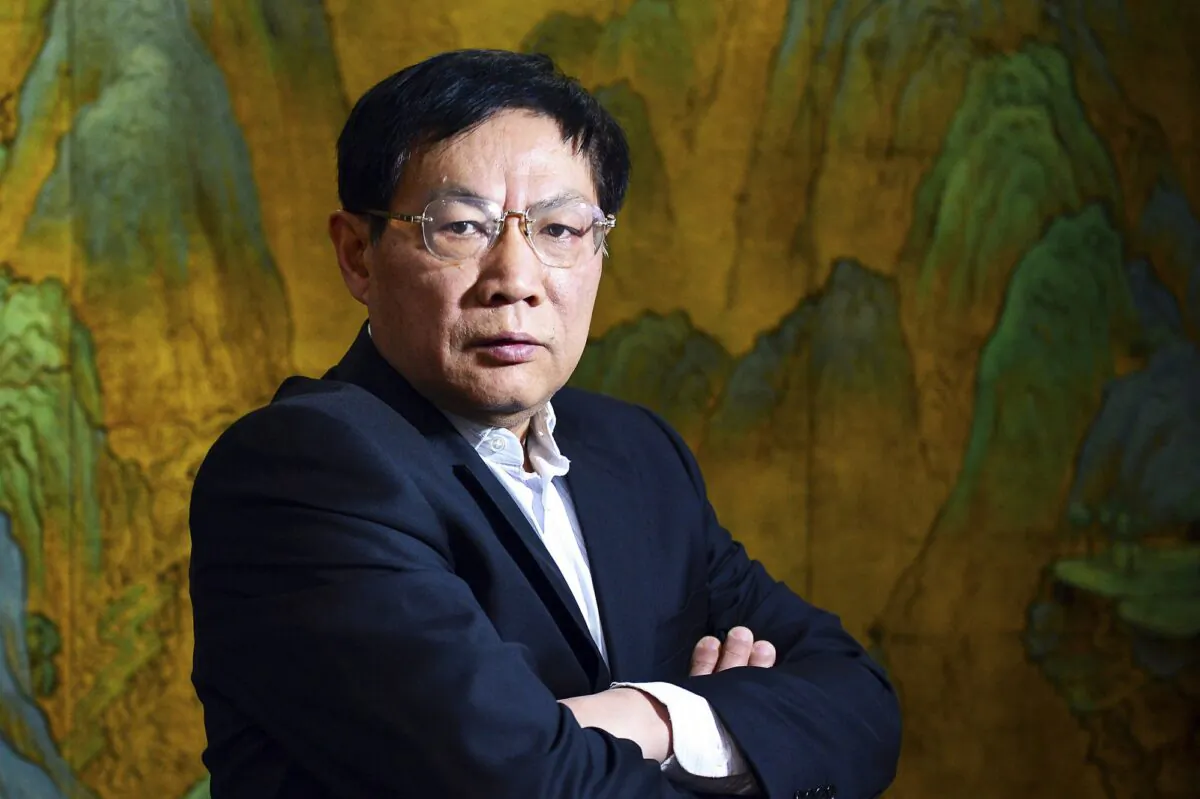 Chinese real estate mogul Ren Zhiqiang poses for photos in his office in Beijing on Dec. 3, 2012. (Color China Photo via AP)
