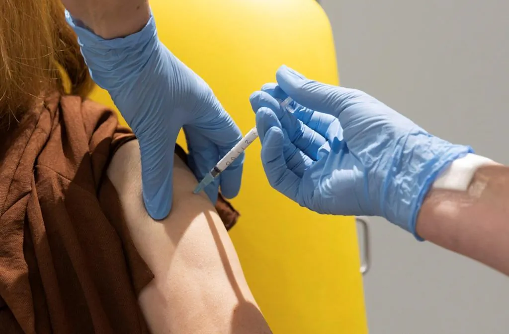 In this handout photo released by the University of Oxford, a volunteer participates in the CCP virus vaccine trial in Oxford, England, on July 7, 2020. (The Canadian Press/AP-University of Oxford via AP)