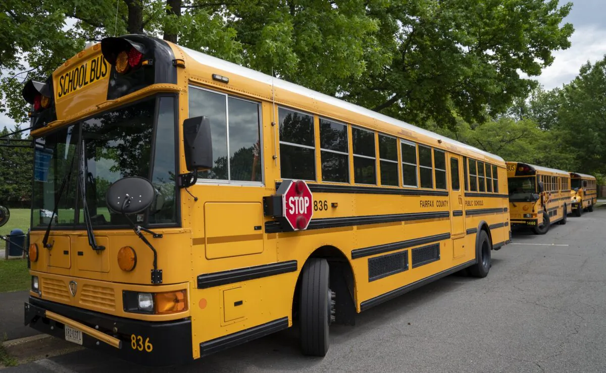 Fairfax County Public School buses parked at a middle school in Falls Church, Va., on July 20, 2020. (J. Scott Applewhite/AP Photo)