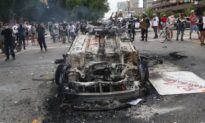 Man Charged for Allegedly Helping Torch Police Car During Riots