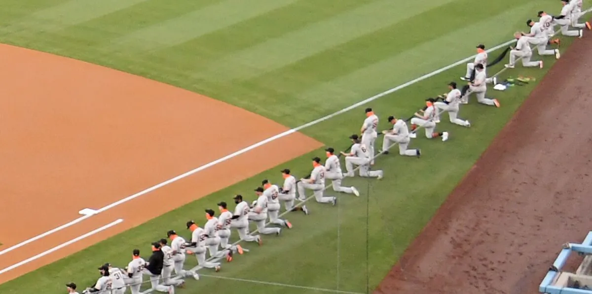 Sam Coonrod, seen standing, was the only player for the San Francisco Giants to not take a knee before the national anthem on Thursday (Harry How/Getty Images)