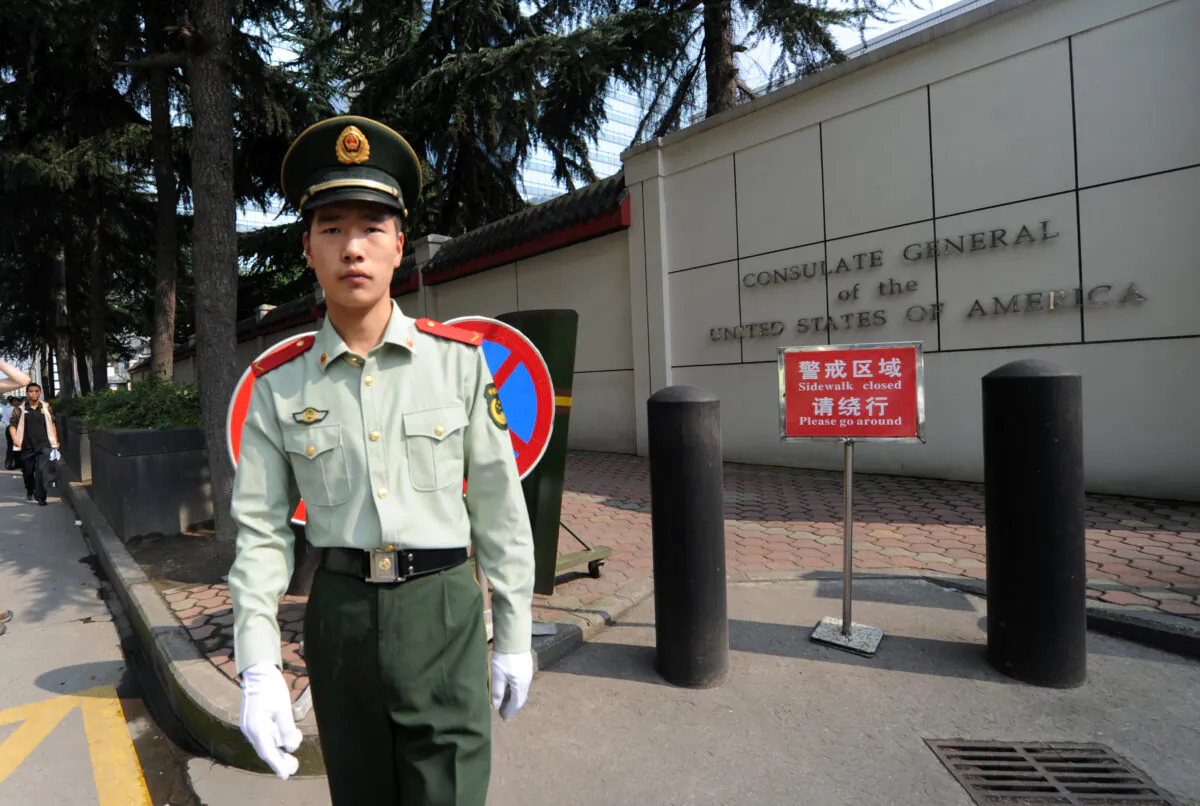 A Chinese paramilitary policeman stands guard at the entrance of the US consulate in Chengdu, southwest China's Sichuan province on Sept. 17, 2012. (Goh Chai Hin/AFP/GettyImages)