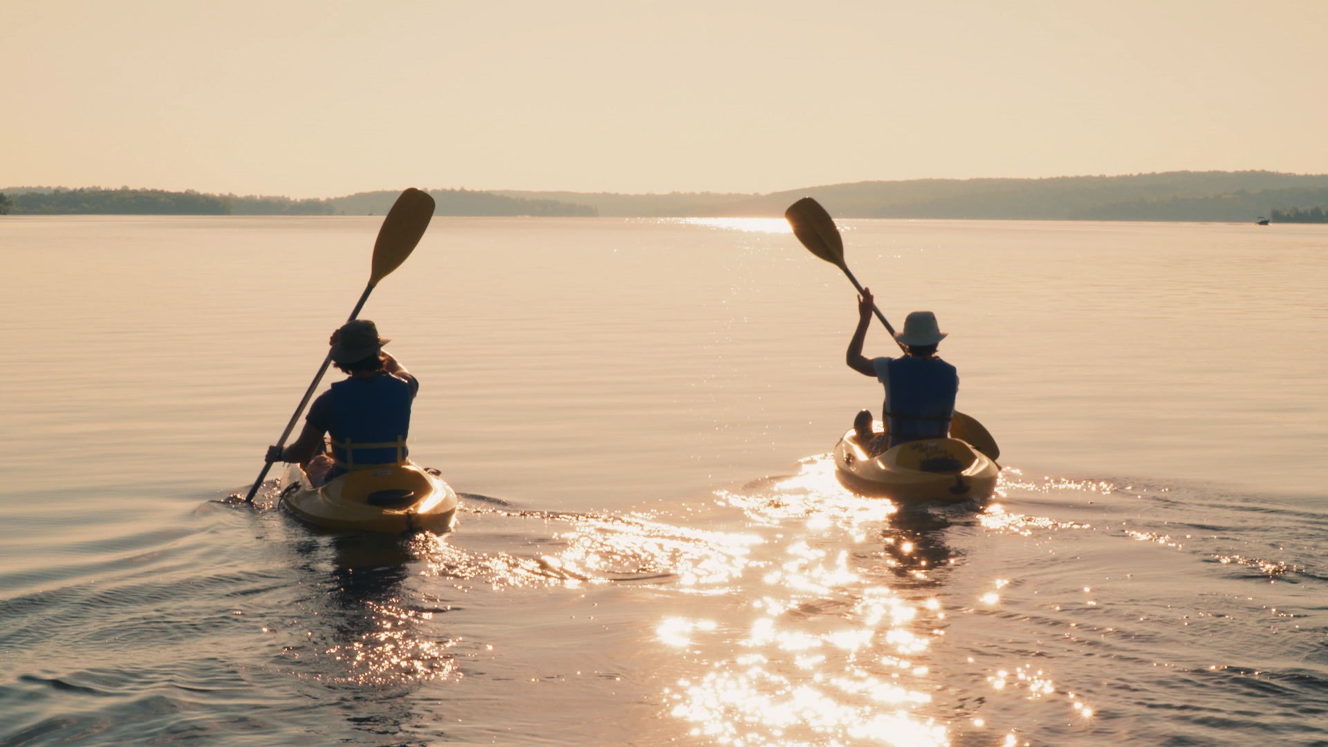 Elmhirsts - Kayak Couple Paddling Into Sunlight