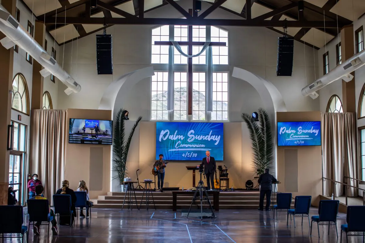 Pastor Rob McCoy leads a communion ceremony after an online Palm Sunday Service at the Godspeaker Calvary Chapel sanctuary on April 5, 2020 in Thousand Oaks, California. (Apu Gomes/AFP via Getty Images)