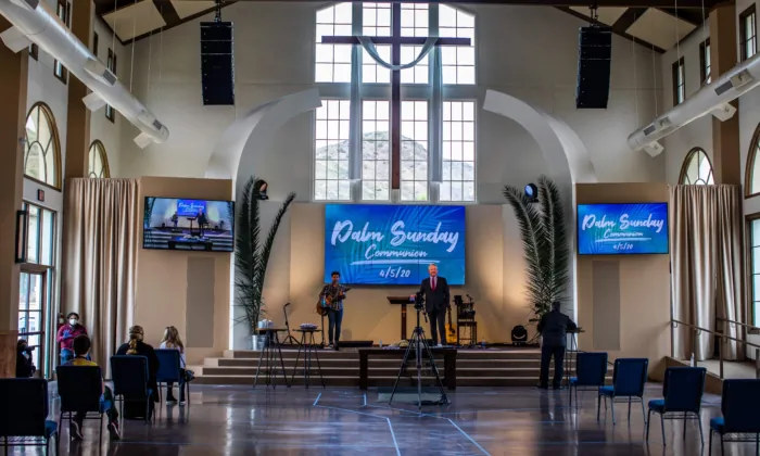 Pastor Rob McCoy leads a communion ceremony after an online Palm Sunday Service at the Godspeaker Calvary Chapel sanctuary on April 5, 2020 in Thousand Oaks, California. (Apu Gomes/AFP via Getty Images)
