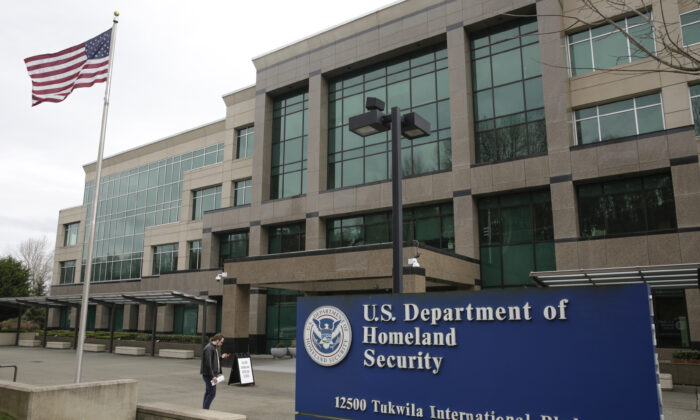 A man stands outside the Department of Homeland Security (DHS) building in Tukwila, Wash., on March 3, 2020. (Jason Redmond/AFP/Getty Images)