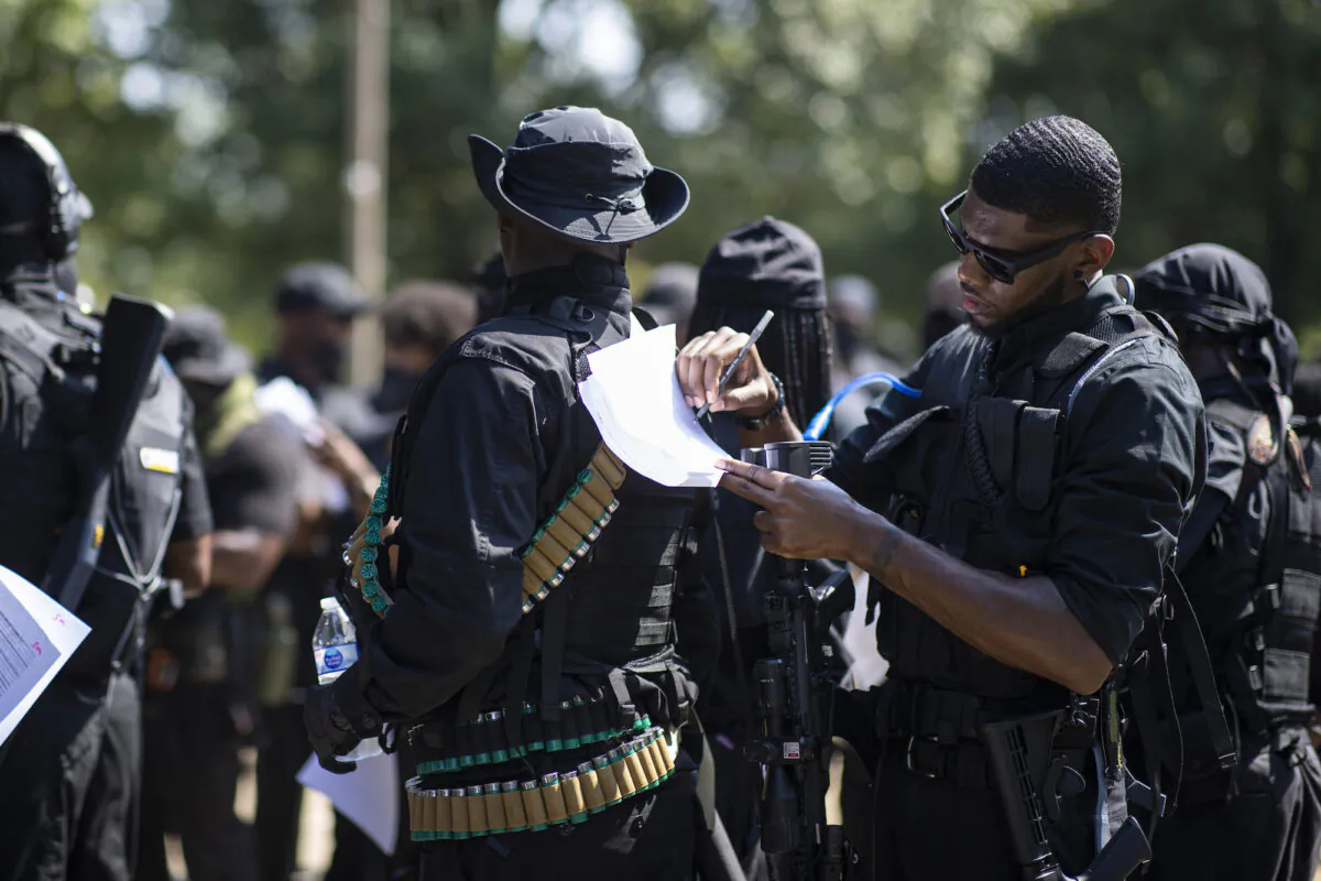 Members of a protest group affiliated with NFAC, most carrying firearms, gather to march in Louisville, Ky, on July 25, 2020. (Brett Carlsen/Getty Images)