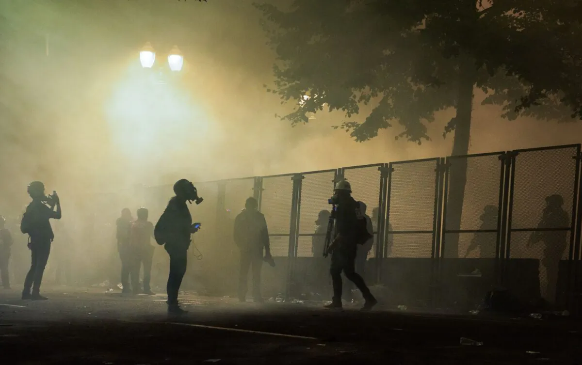 Rioters are surrounded by tear gas near the Mark O. Hatfield Courthouse in Portland, Ore., late July 24, 2020. (Kathryn Elsesser/AFP via Getty Images)