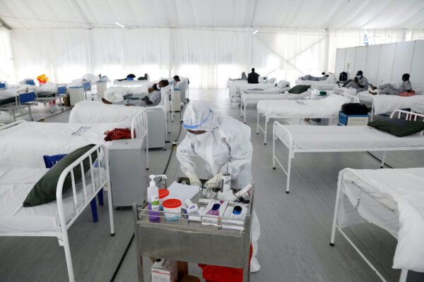 A nurse works inside a field hospital built on a soccer stadium in Kenya
