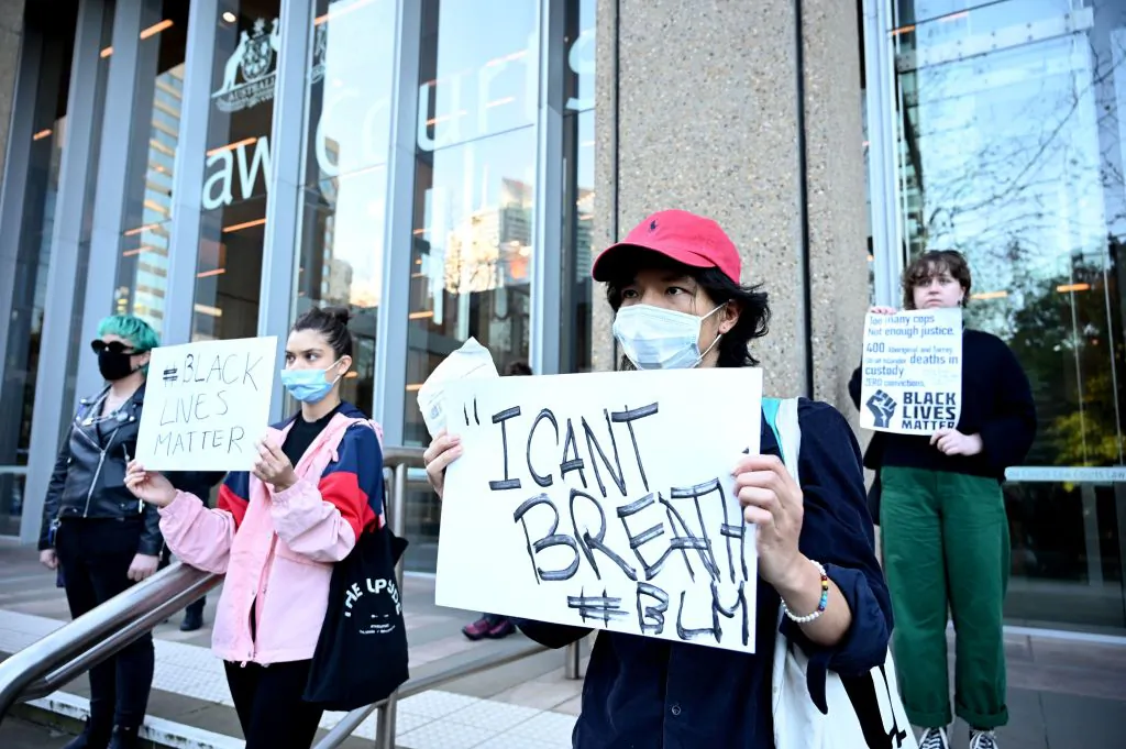 Protesters stand outside the Supreme Court in Sydney, Australia on June 5, 2020. Around 10,000 joined Black Lives Matter protest on June 6. (Peter Parks/AFP via Getty Images)