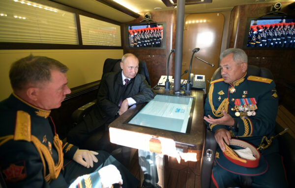Russian President Vladimir Putin, Defence Minister Sergei Shoigu and Commander of the Western Military District of Russian Armed Forces Alexander Zhuravlyov