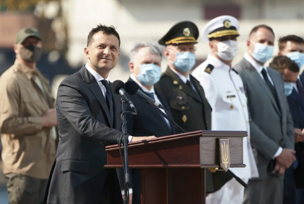 Ukrainian President Volodymyr Zelenskiy, foreground, and high-ranking officials wearing face masks to protect against coronavirus watch a navy parade on Ukraine's Navy Day in the Black Sea Port of Odesa, Ukraine, on July 5, 2020. (Ukrainian Presidential Press Office/AP Photo)