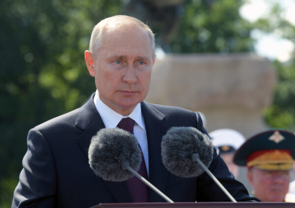 Vladimir Putin delivers a speech during the Navy Day parade