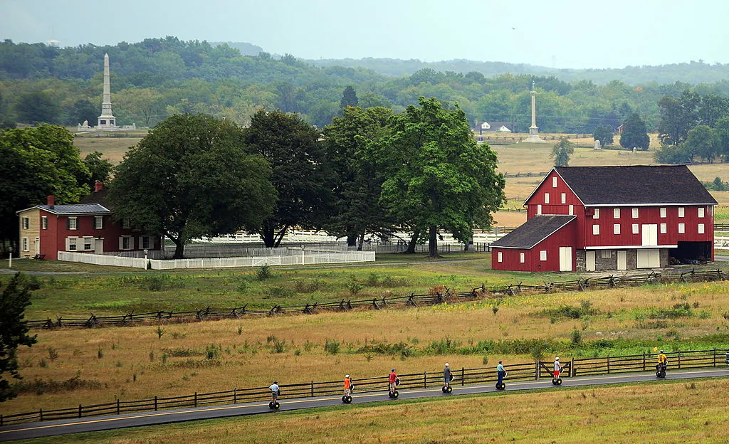 A Segway tour passes the historic Codori farm, which sits in the heart of the battle field on August 11, 2010, at Gettysburg National Military Park. (KAREN BLEIER/AFP via Getty Images)