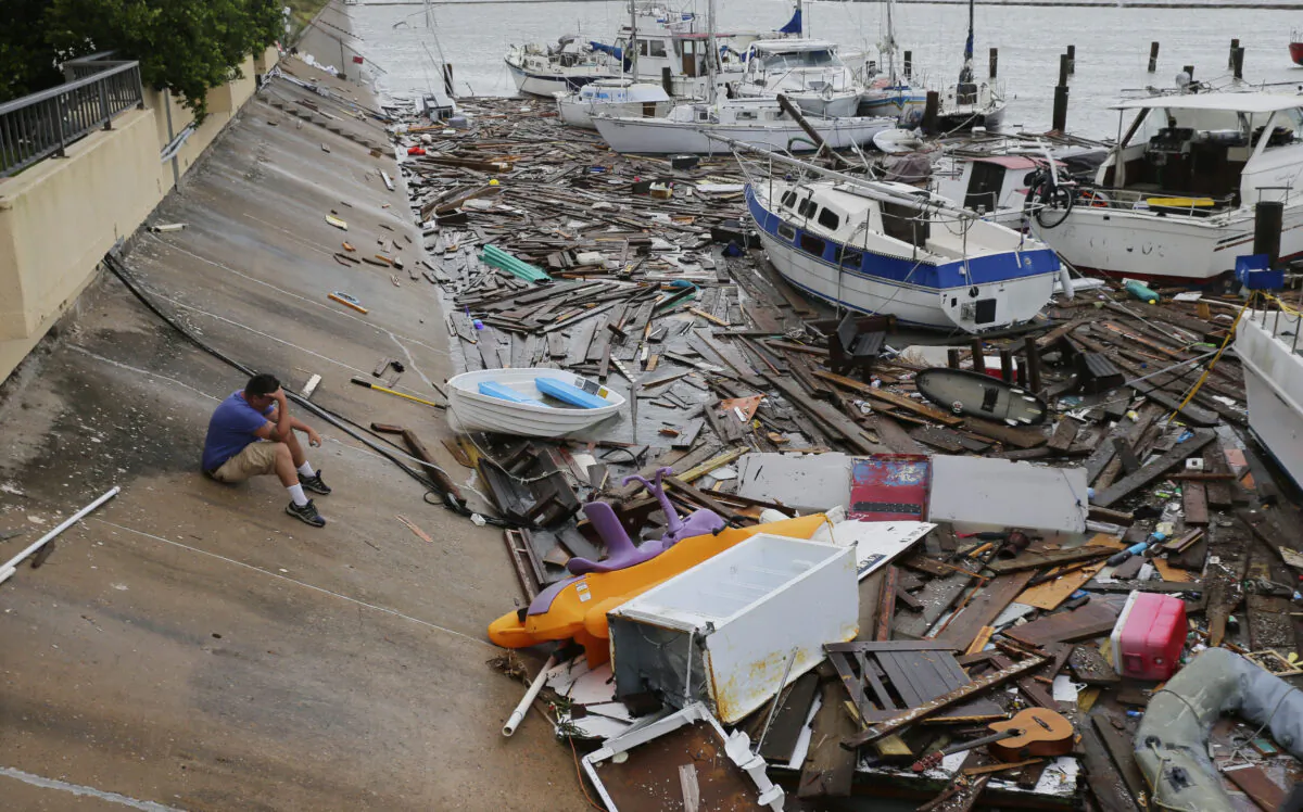 Allen Heath surveys the damage to a private marina after it was hit by Hurricane Hanna, in Corpus Christi, Texas, on July 26, 2020. (Eric Gay/AP Photo)