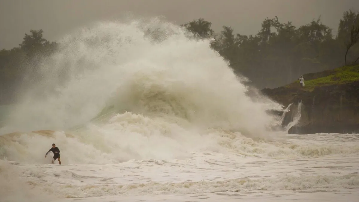 A surfer takes on a wave generated by Hurricane Douglas at Laie Beach Park on July 26, 2020, in Laie, Hawaii. (Eugene Tanner/AP Photo)