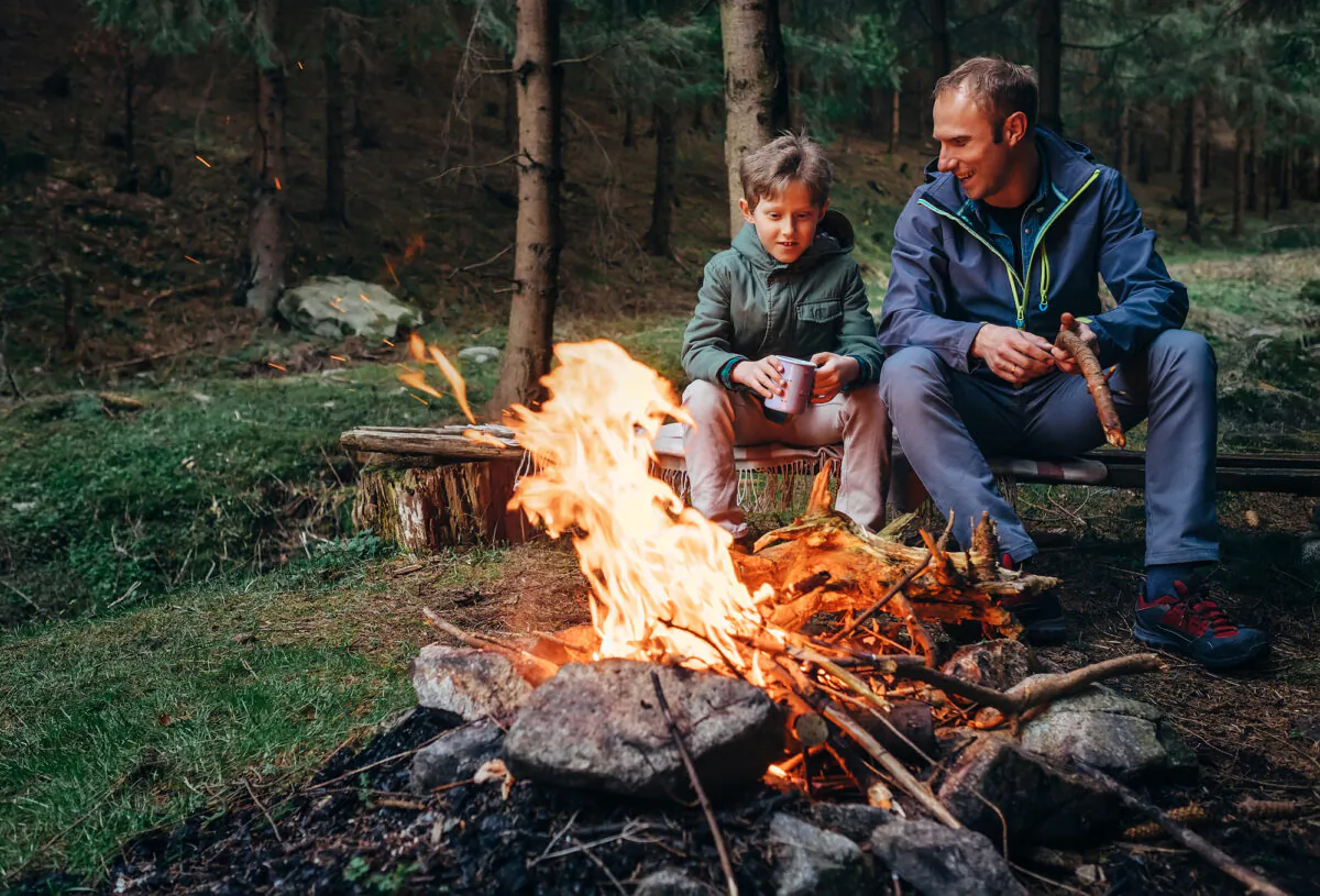 A highlight of camping: good company around a fire. (Soloviova Liudmyla/Shutterstock)
