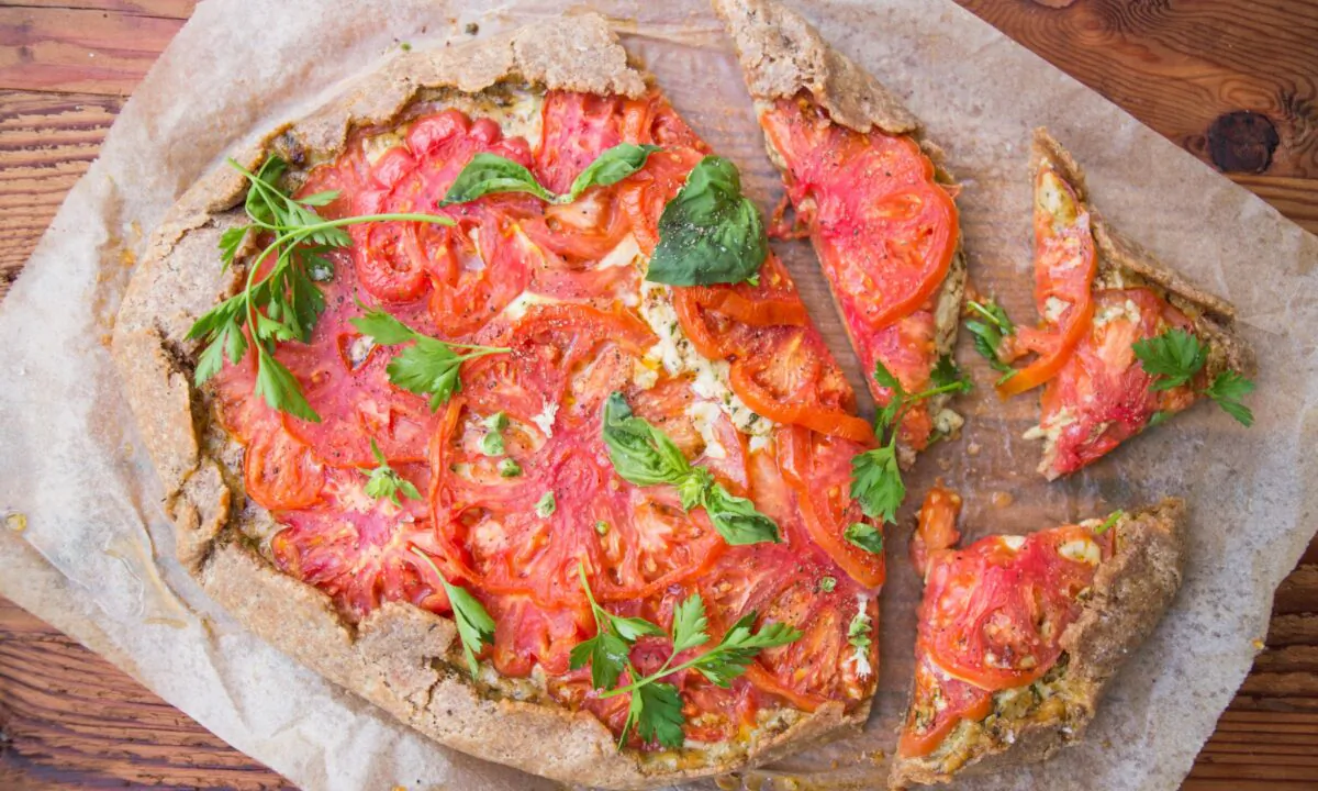 Homemade crust, tons of cheese, and both fresh and sun-dried tomatoes bake up into gooey tomato pie perfection. (Caroline Chambers)
