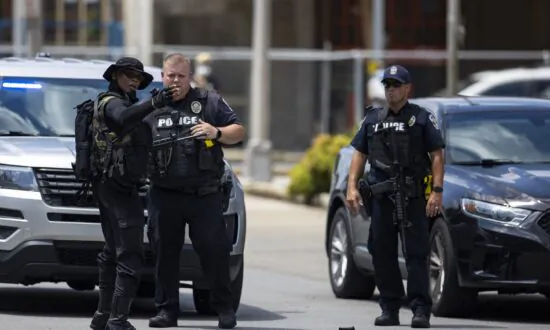 Police Officer Recounts Militia Leader Pointing Rifle at Him
