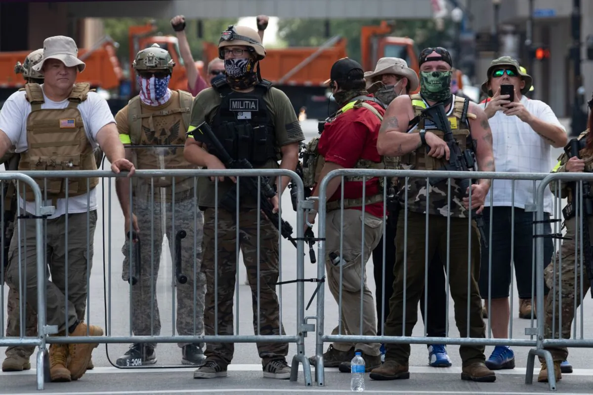 Supporters of the Kentucky Three Percenters militia during a rally by NFAC in Louisville, Ky., on July 25, 2020. (Jeff Dean/AFP via Getty Images)