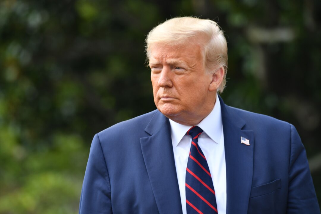 President Donald Trump speaks to the press before departing from the White House in Washington on July 27, 2020. (Nicholas Kamm/AFP via Getty Images)