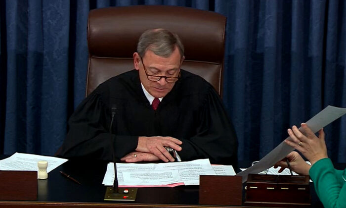 Chief Justice John Roberts announces the results of the vote on the second article of impeachment during impeachment proceedings against President Donald Trump in the Senate at the Capitol in Washington on Feb. 5, 2020. (Senate Television via Getty Images)